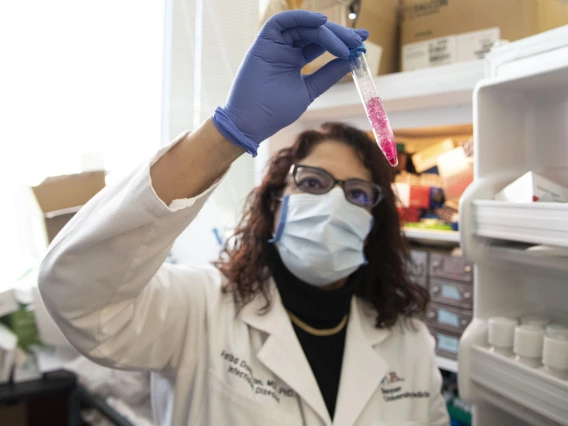 female lab tech examining test-tube 