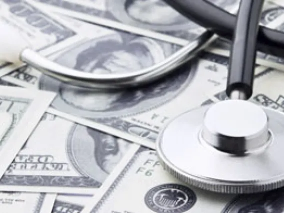 Stethoscope and money in form of bills