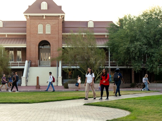 Old Main building with students walking