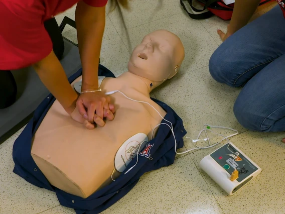 continuous chest compression CPR on a manikin