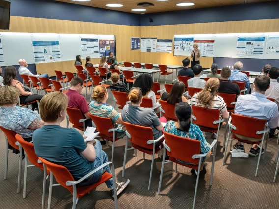 [DOM vice chair of research Janet Funk, MD, a Division of Endocrinology researcher whose work focuses on bioactivity of turmeric-derived curcuminoids and related metabolites in breast cancer, welcomes participants in the inaugural SOAR in DOM research forum.]