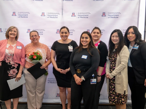 [Dawn Henderson (2nd from left with flowers), winner of the Mentorship Award, with (from left) Cynthia Campas, Nephrology’s Bersabe Lopez, Pulmonary’s Jacque Carrillo, Gastroenterology’s Carmen Mendoza, Phetcharat “Pat” Chen, and Dominica Padilla.]