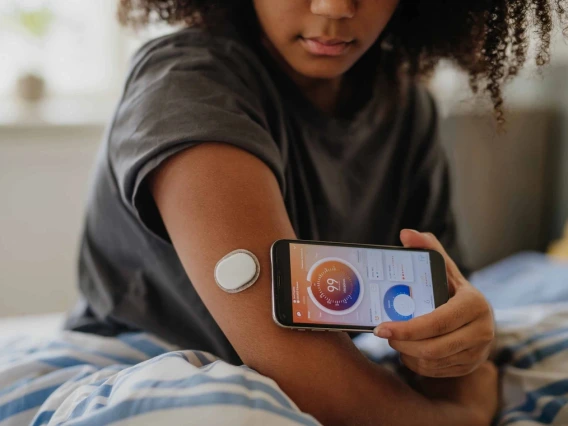 Person using a smart phone to obtain biometrics