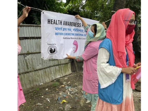 woman hanging health conference sign