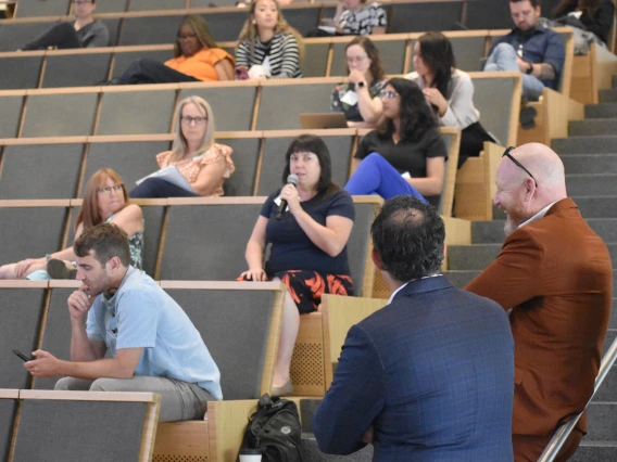 [CTDW 2025 co-leader Franz Rischard, DO (in rust-colored suit), prepares to respond to a question. In second row is Michael Insel, MD, also an APD in the PCCM/CCM Fellowships. In fourth row, in orangish top, is Heidi Erickson, RN, Pulmonary division research manager. And, in fifth row, second seat in, is Anna Morenz, MD, MPH, assistant professor in the Division of General Internal Medicine, Geriatrics & Palliative Medicine.]