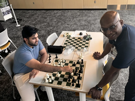 [Class of 2026 COM-T medical student Rohan Mittal and Venki Aryamuthu, MD, play at a higher rate of speed and decision-making in their match.]