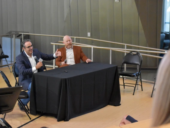 [CTDW co-leader Jarrod Mosier, MD (left), with Franz Rischard, DO (right), answers a question from Corey Casper, MD, Banner Research chief, on how the U of A Health Sciences colleges and their centers and institutes work together to bring the latest experimental therapies to patients via clinical trials – and the intricacies and detail that requires.]