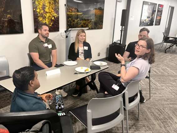 [At the IM Research Mixer, residency program director Laura Meinke, MD, a critical care medicine specialist in the Pulmonary division, chats with IM interns (from left) Khaja Siddiqui, MD, Ryan Schmidt, MD, and Emily Adamson, DO, with Eric Brucks, MD, a Tucson VA Medical Center physician who’s an associate program director for the IM Residency – Tucson program there.]