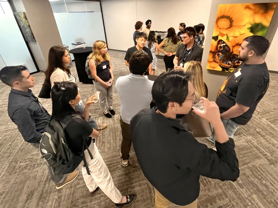 [IM Residency – Tucson chief residents (center, top of photo) Sam Cheong, DO, and Max Hart, MD, MEd, answer questions from new interns in the program about how they can fit research into their workloads and various efforts underway in the U of A Health Sciences colleges and its various centers and institutes.]