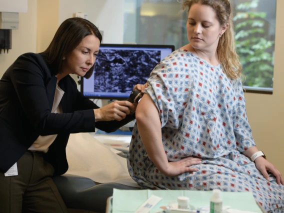 Dr. Clara Curiel examines a patient