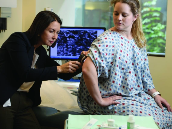 Dr. Clara Curiel examines a patient