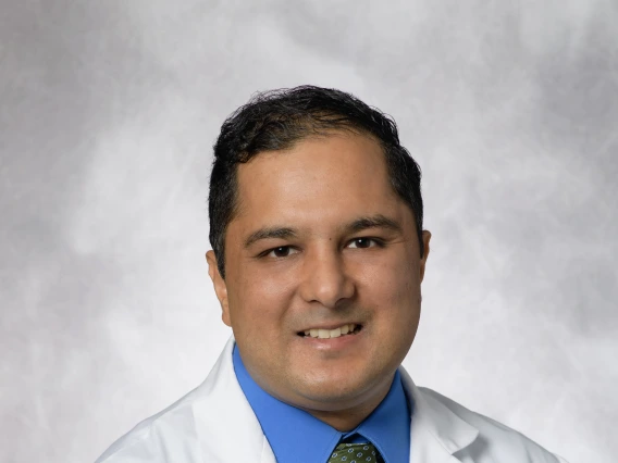 Dr. Ashish Sethi in white coat