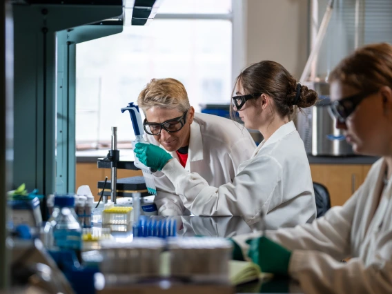 Students working in a medical lab with a professor at the university of arizona