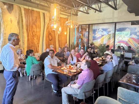 [The whole PACCS division team listens as Dr. Sairam Parthasarathy extolls on all of Dr. Christian Bime’s contributions to the clinical mission, the research mission and the teaching mission of the division in Tucson.]