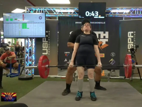 [Julia Indik, MD, PhD, clinches the deadlift at 292 pounds with okays from the judges, and a world and national record for her age and weight class at the USPA Southwest Regionals in Tucson on Oct. 25, 2025.]