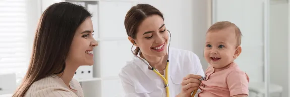 Pediatric Doctor, infant and mother during appointment