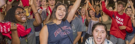 a group of college students celebrating.