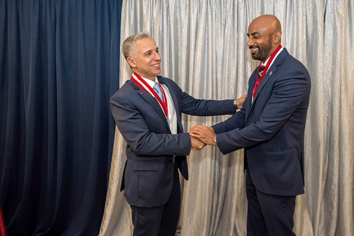 Congratulating each other on their new status as College of Medicine – Tucson endowed chairs: Hesham Sadek, MD, PhD, Cardiology division chief and Sarver Heart Center director, and Sakthivel Sadayappan, PhD, chair, Department of Cellular & Molecular Medicine, and associate director, Sarver Heart Center.