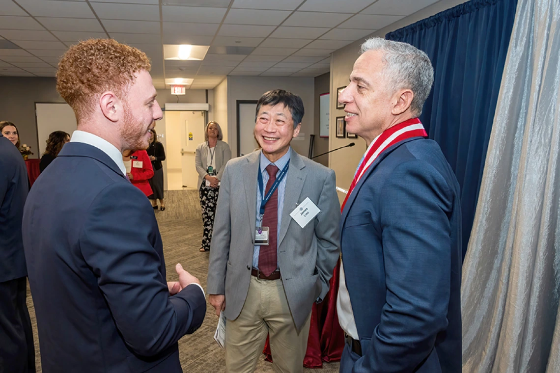James K. Liao, MD, chair, Department of Medicine, shares a lighter moment with Ali Sadek (left), a UT Southwestern medical student and son of Cardiology division chief and Sarver Heart Center director Hesham Sadek, MD, PhD (right).