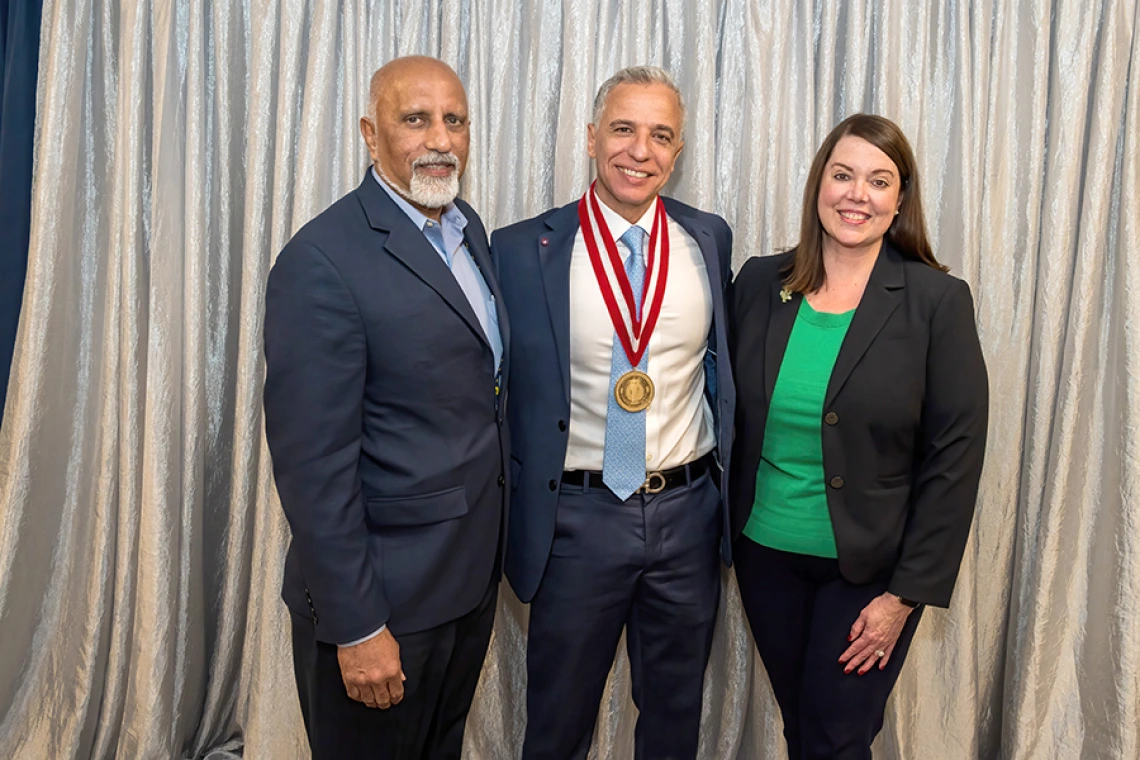 Venkata “Bob” Evani, MD (left), CEO of Banner – University Medical Group and president of Banner Academics, and Allison Flynn Gaffney, FACHE, CEO of Banner – University Medical Center Tucson and South, congratulate College of Medicine – Tucson Cardiology division chief and Sarver Heart Center director Hesham Sadek, MD, PhD, on his investiture.