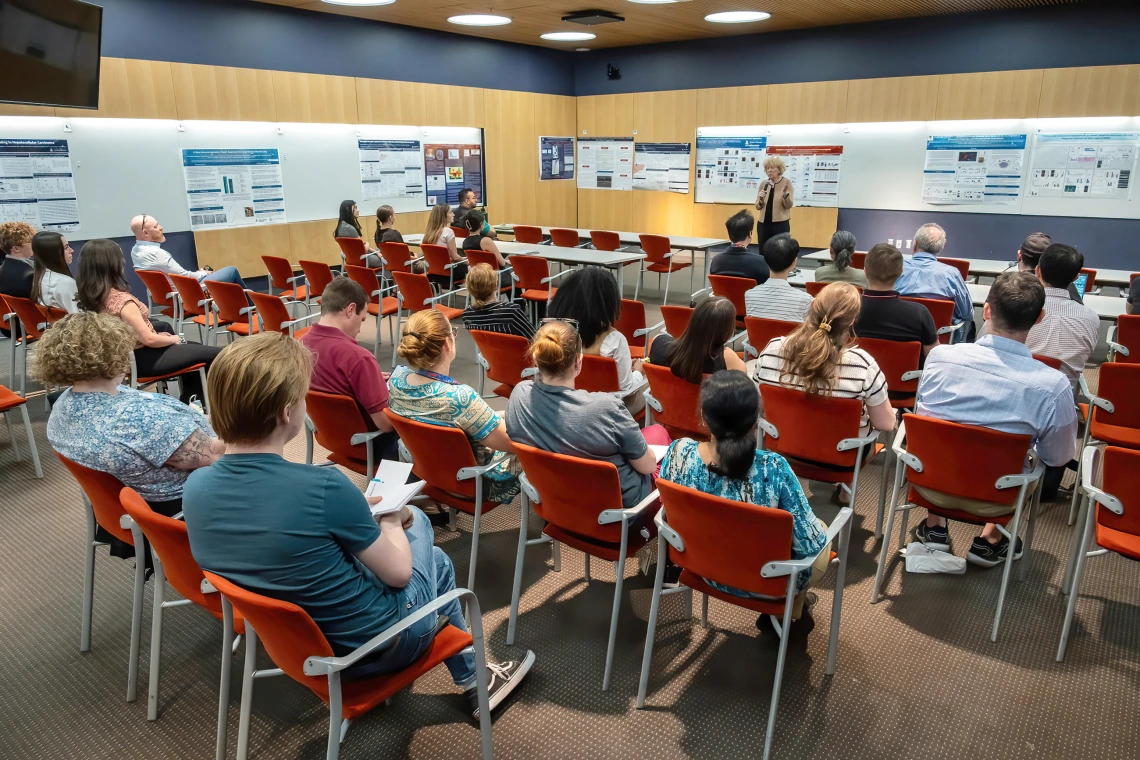 [DOM vice chair of research Janet Funk, MD, a Division of Endocrinology researcher whose work focuses on bioactivity of turmeric-derived curcuminoids and related metabolites in breast cancer, welcomes participants in the inaugural SOAR in DOM research forum.]