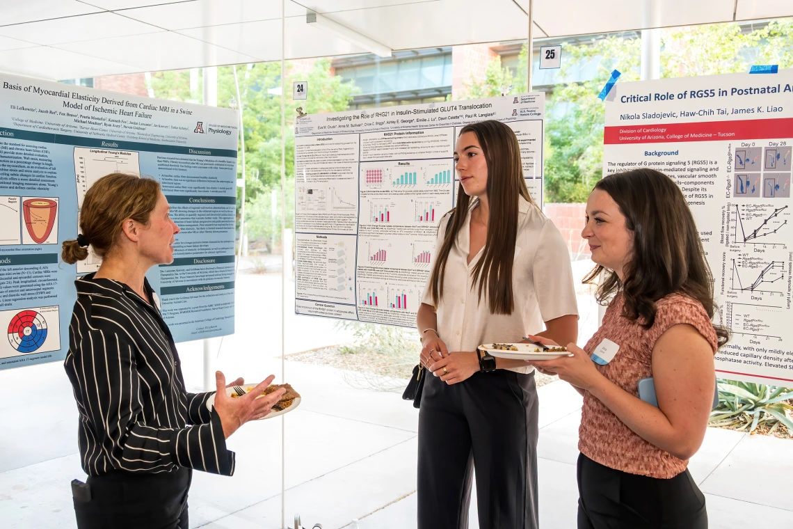 [Division of Endocrinology’s Jennifer Stern, PhD, talks to two people interested in expanding their experience in biomedical research at the University of Arizona at the SOAR in the DOM Forum.]
