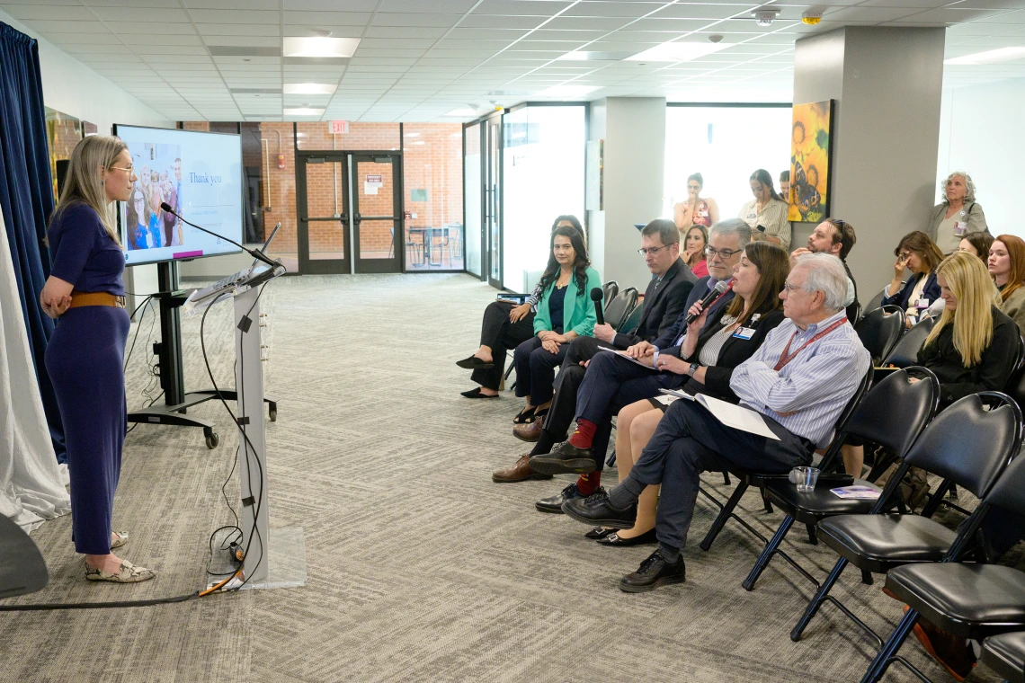 [Amy Klein, MD, listens to a question from Alison Flynn-Gaffney, CEO of Banner – University Medical Center Tucson and South, in the front row with BUMG CEO David Orlandi, MD, MBA, and the PACCS division’s Gordon Carr, MD, CMO at Banner – UMC Tucson, to her right.]