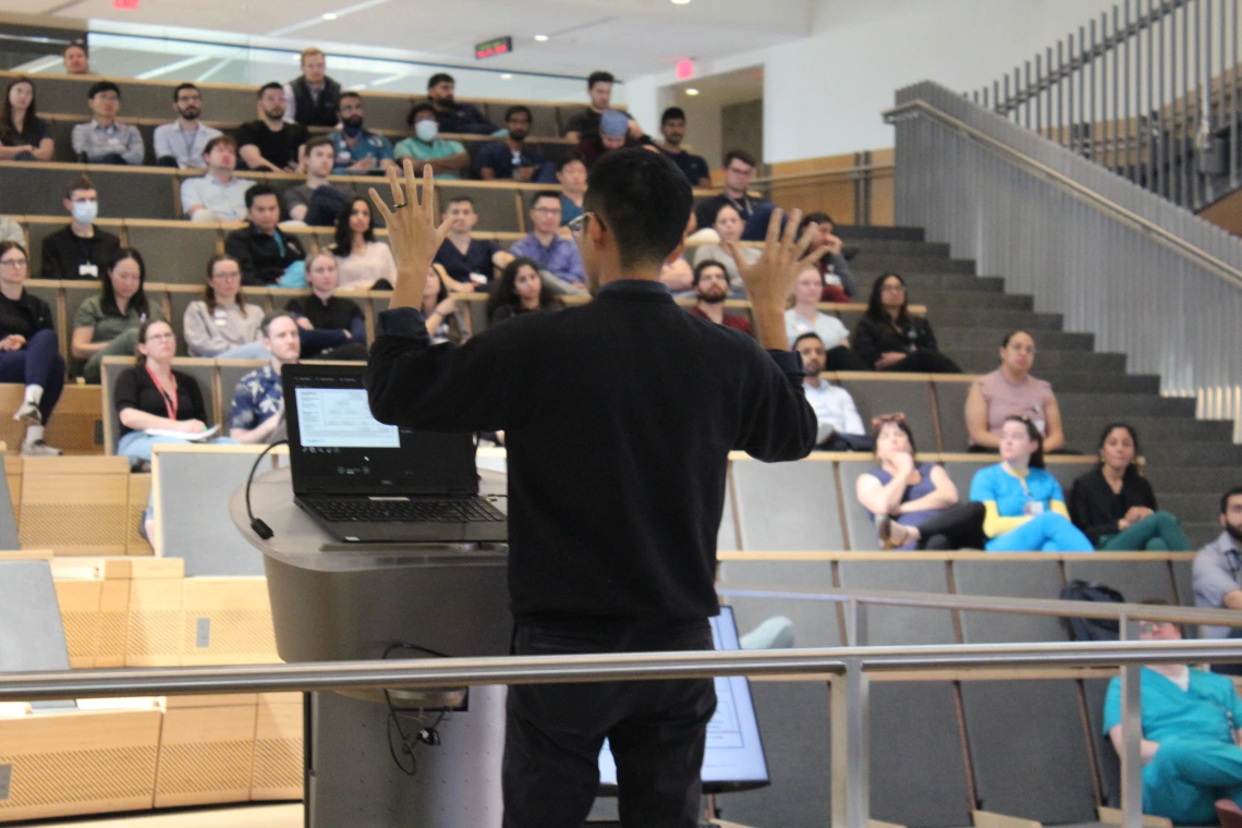 [PGY-3 Mateo Mendoza, MD, gesticulates during his award-winning oral presentation on “Assessing the Utility of Provocative Maneuvers During Right Heart Catheterization in Pulmonary Venous Hypertension.” ]