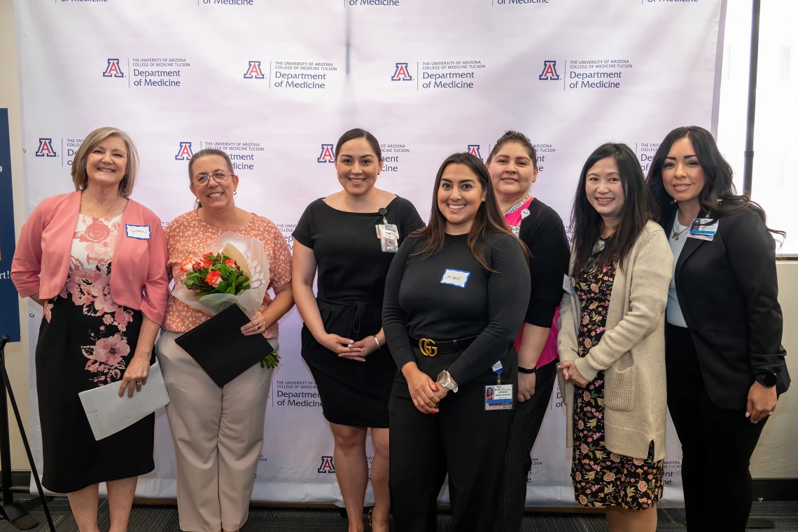 [Dawn Henderson (2nd from left with flowers), winner of the Mentorship Award, with (from left) Cynthia Campas, Nephrology’s Bersabe Lopez, Pulmonary’s Jacque Carrillo, Gastroenterology’s Carmen Mendoza, Phetcharat “Pat” Chen, and Dominica Padilla.]