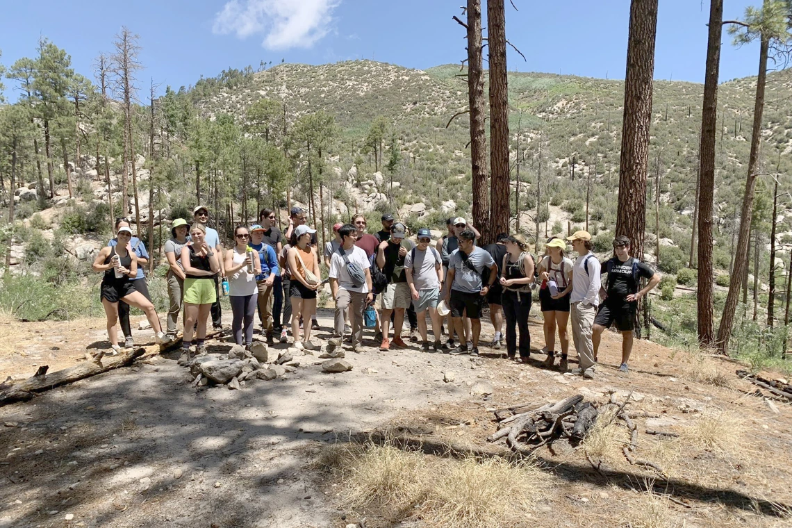 [A group of interns with chief residents Tyler Gloe, DO, and Josh Sethi, MD, MS, in the Catalina Mountains north of Tucson for a teambuilding hike in cooler weather. Temperatures vary from 20-30 degrees cooler on Mount Lemmon.]
