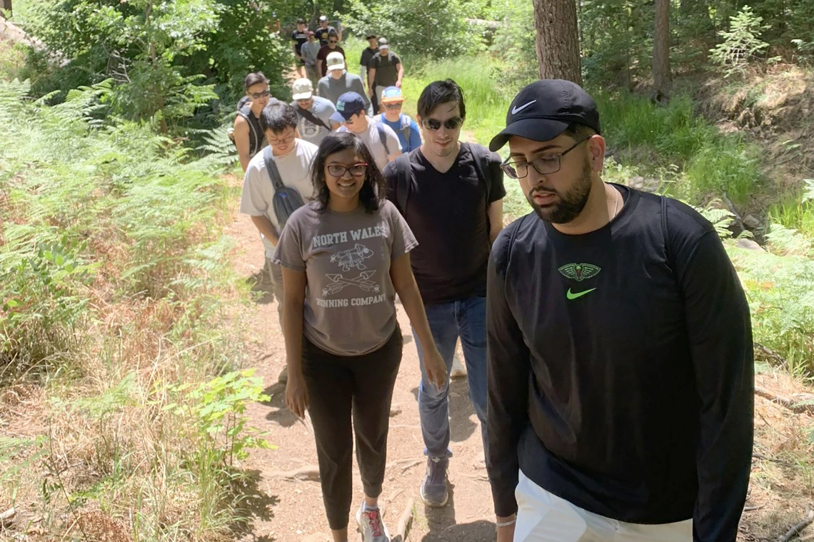 [IM Chief Resident Josh Sethi, MD, MS, leads the pack on their 3.6 mile Mount Lemmon hike, June 22. About 45 minutes from the U of A campus, Mount Lemmon is 9,159 feet above sea level – the second highest point in the mountain ranges surrounding Tucson. The highest is Mount Wrightson in the Santa Rita Mountains south of Tucson at 9,453 feet.]