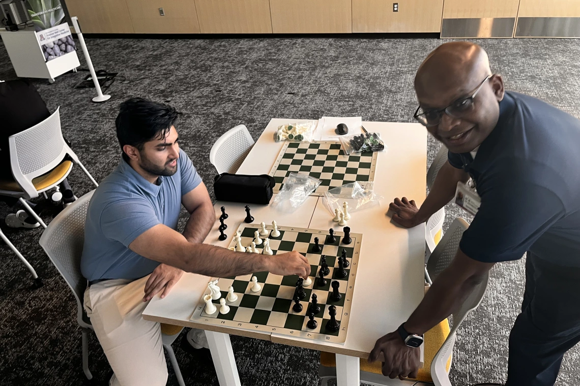 [Class of 2026 COM-T medical student Rohan Mittal and Venki Aryamuthu, MD, play at a higher rate of speed and decision-making in their match.]