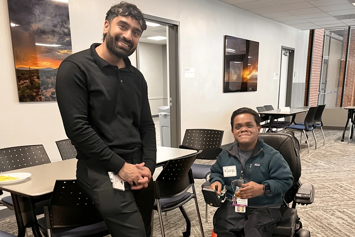 [New interns in the IM Residency – Tucson program Mujtaba Shah, DO, and Khaja Siddiqui, MD, enjoy a chat June 30 during the Internal Medicine Research Mixer in the COM-T Social Hall.]