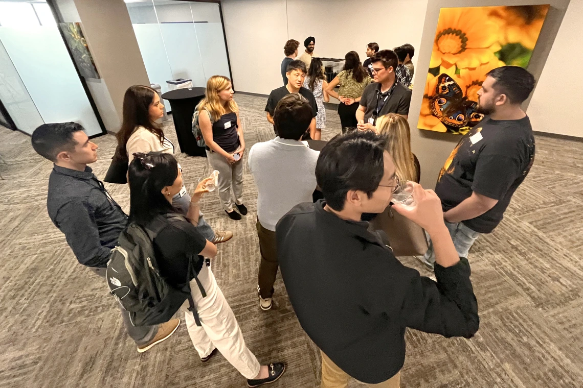 [IM Residency – Tucson chief residents (center, top of photo) Sam Cheong, DO, and Max Hart, MD, MEd, answer questions from new interns in the program about how they can fit research into their workloads and various efforts underway in the U of A Health Sciences colleges and its various centers and institutes.]