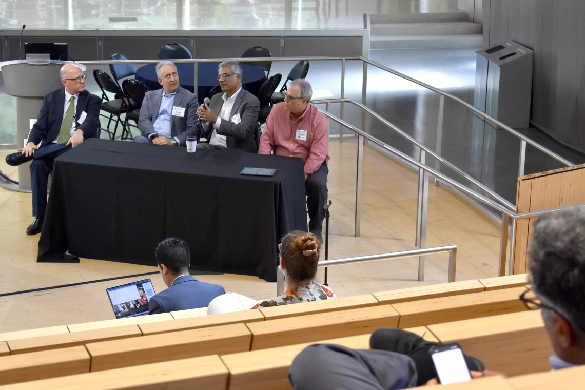 [Panelists discuss the passion that drives researchers as well as benefits of hosting various forums to share related interests among potential collaborators and, in particular to Sairam Parthasarathy, MD (holding microphone), shares early advice he got from a mentor in the first year of his fellowship. That advice was, if you’re a good physician, you may have a great impact on one patient or a dozen patients, but a scientific discovery can broaden that to dozens, hundreds or thousands.]