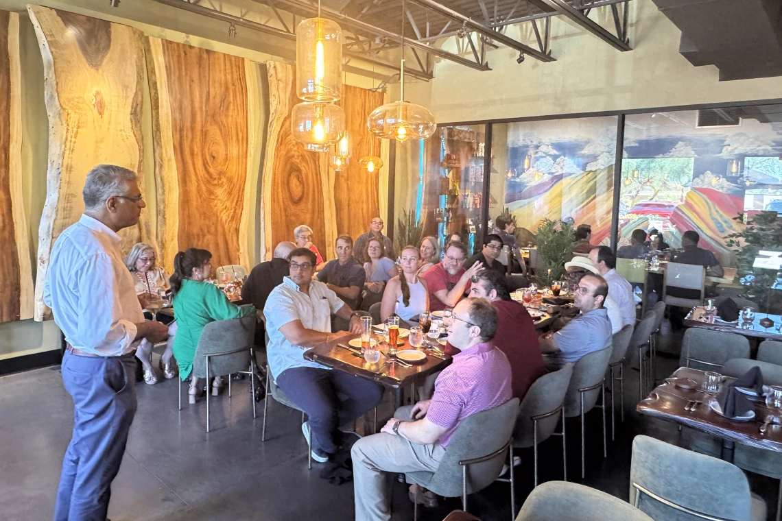 [The whole PACCS division team listens as Dr. Sairam Parthasarathy extolls on all of Dr. Christian Bime’s contributions to the clinical mission, the research mission and the teaching mission of the division in Tucson.]