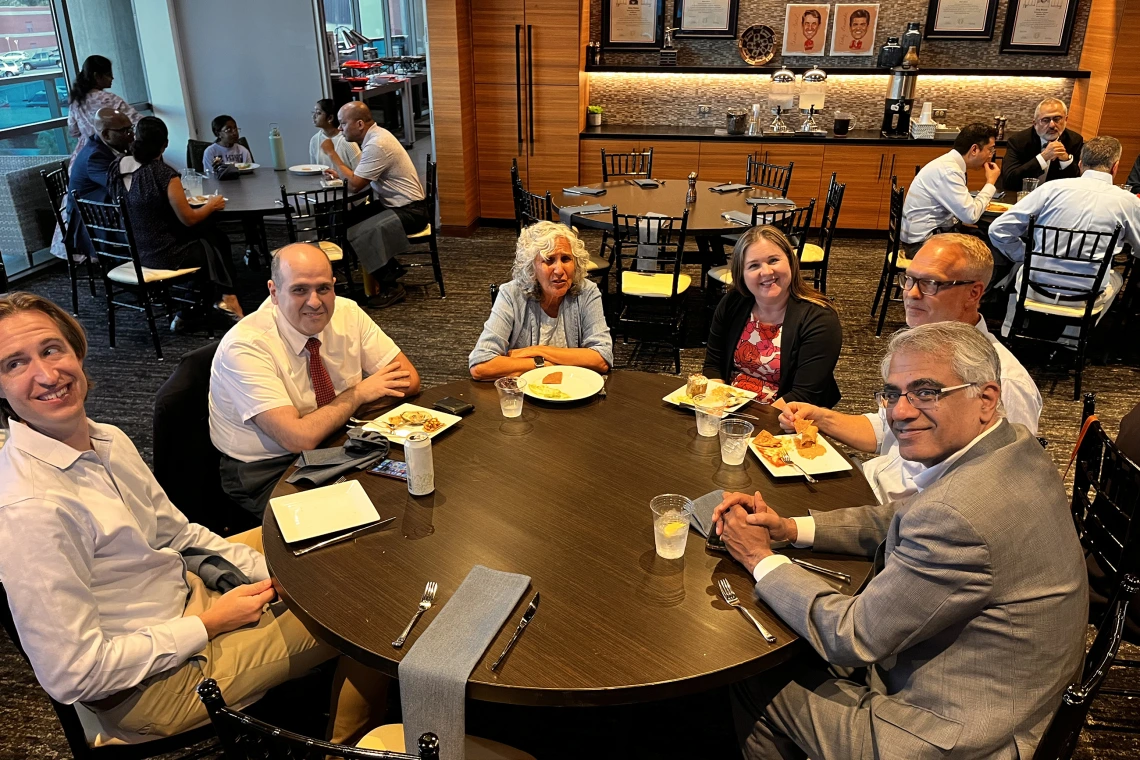[From left, the Pulmonary division’s Daniel Combs, MD, and Saif Mashaqi, MD; Mindy Fain, MD, chief, Division of Geneal Internal Medicine, Geriatrics & Palliative Medicine, with Joy Bulger Beck, MD, MS, and her husband; and Pulmonary chief Sairam Parthasarathy, MD.]