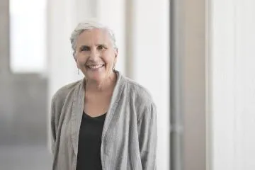 Younger man working with older person to manage medication