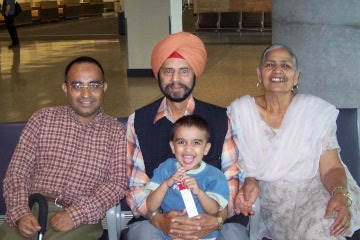 Alex Singh Parmar as a boy, with his father (left) and grandparents