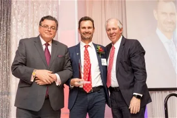 (From left) Michael M. I. Abecassis, MD, MBA, dean of the UArizona College of Medicine in Tucson; Todd Vanderah, PhD, professor and department head of the UArizona College of Medicine at Tucson's Department of Pharmacology; and UArizona President, Robert C. Robbins, MD, pause for a photo at the Alumni of the Year awards celebration.