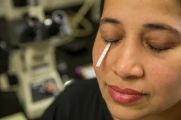 Induvahi Veernala, postdoctoral research associate, with a tear strip placed under her lower eyelid