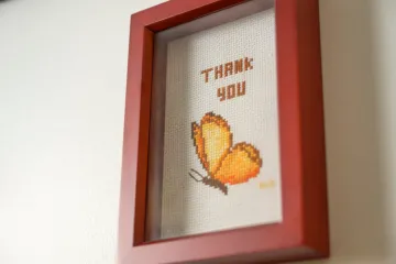 cross-stitch butterfly with "Thank You" text